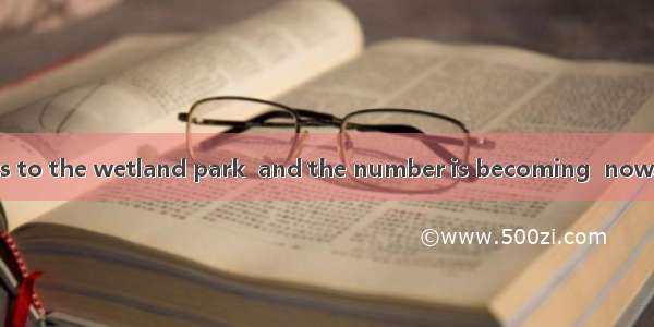 There are  visitors to the wetland park  and the number is becoming  now.A. thousand of; l